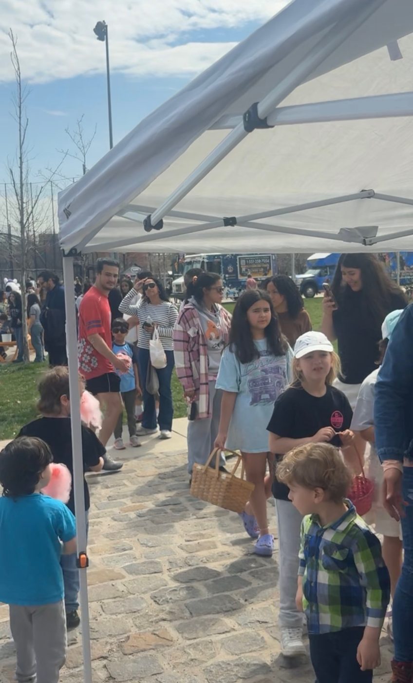 Children with baskets lining up at the Mending Minds and Hearts tent