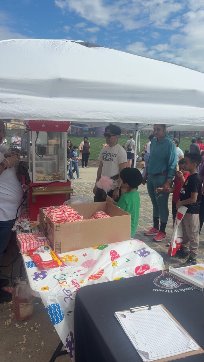 Families visiting the treats table at the egg hunt
