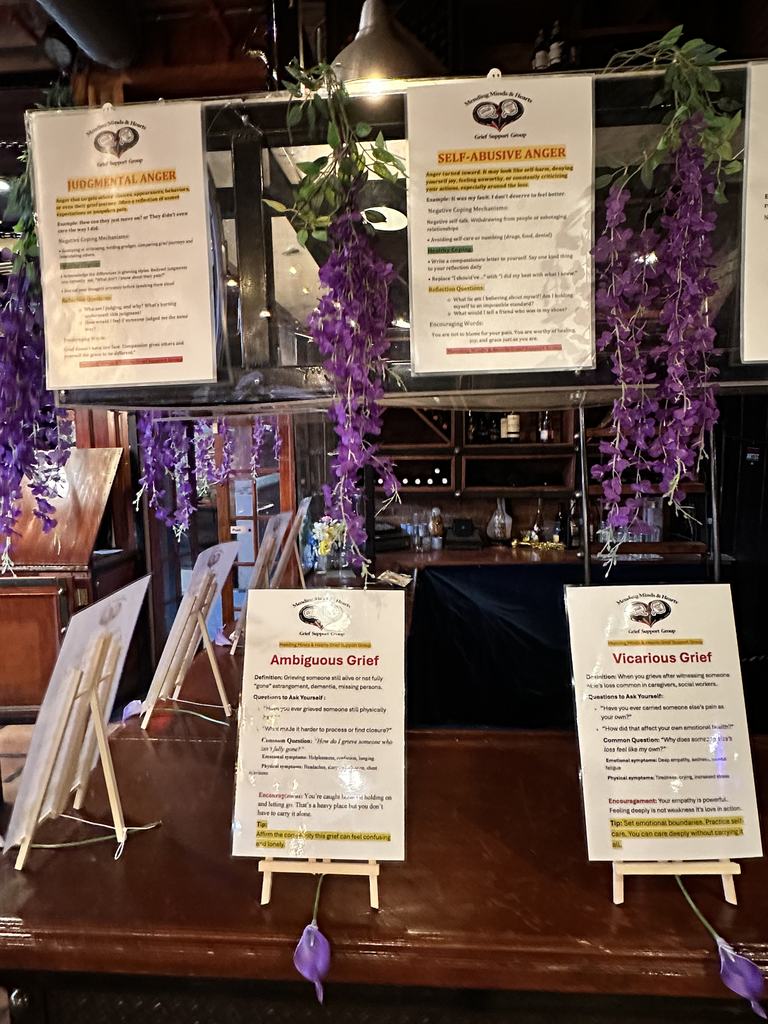 Additional grief education display cards on easels at the fundraiser