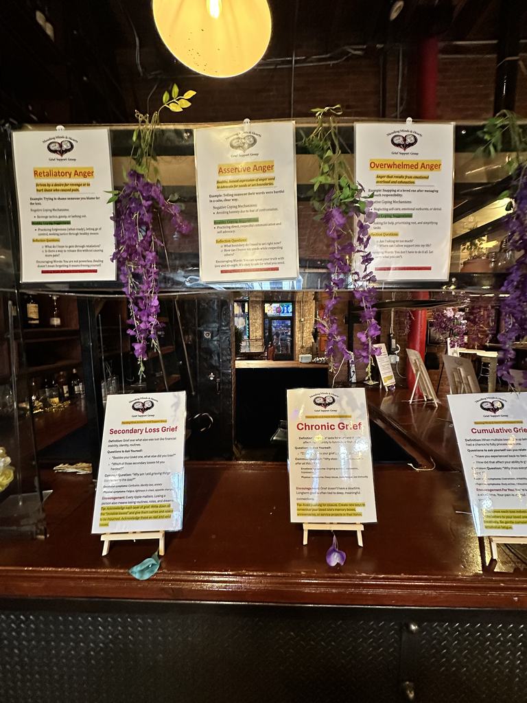 Grief education cards covering types of anger and grief displayed at the fundraiser