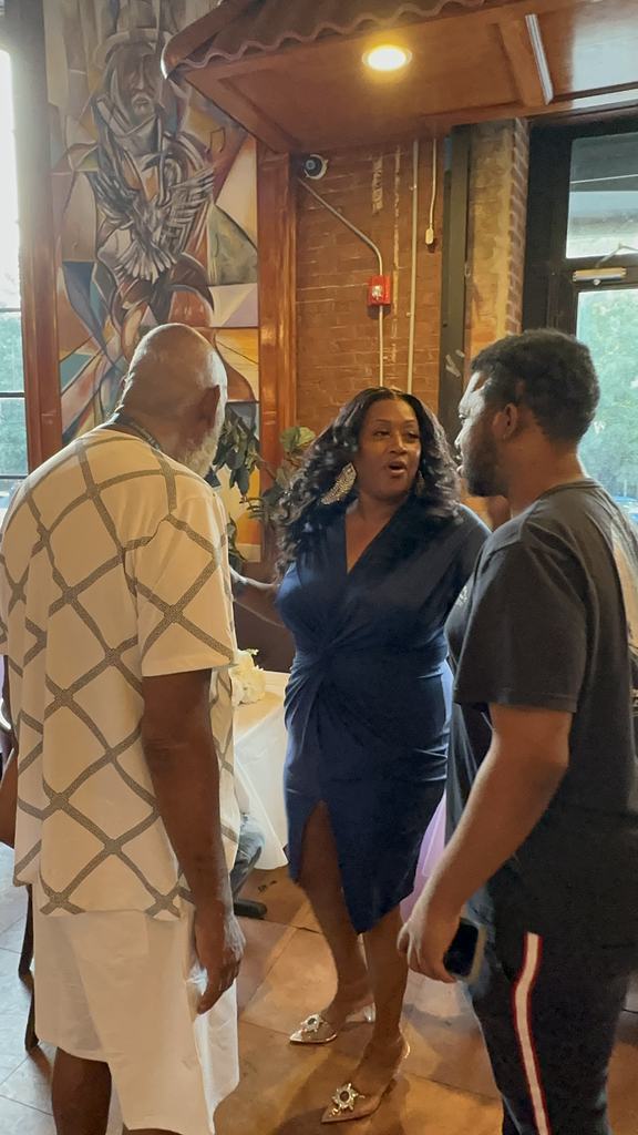 The founder in conversation with supporters at the fundraiser