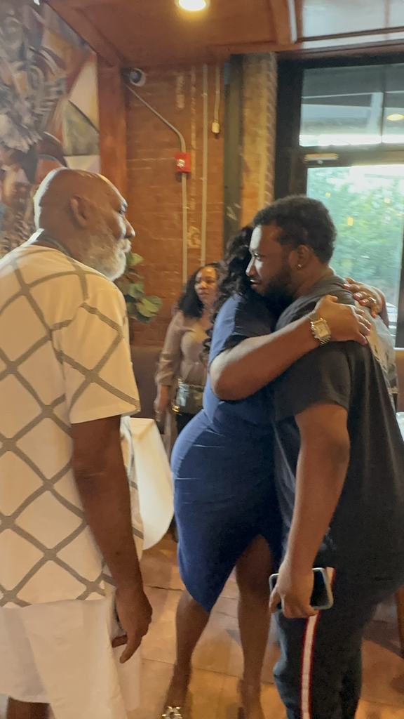The founder embracing a supporter at the Gift of Life Fundraiser