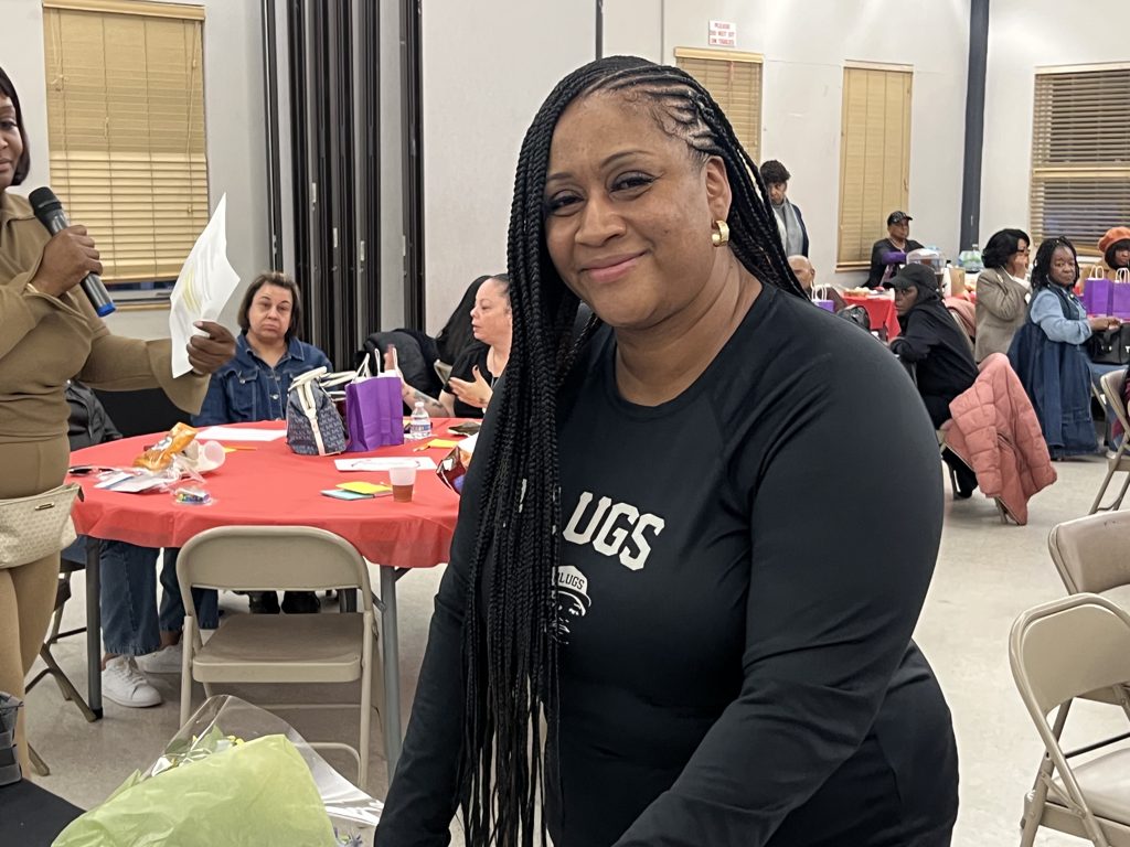 A smiling participant at the Permission to Grieve Workshop