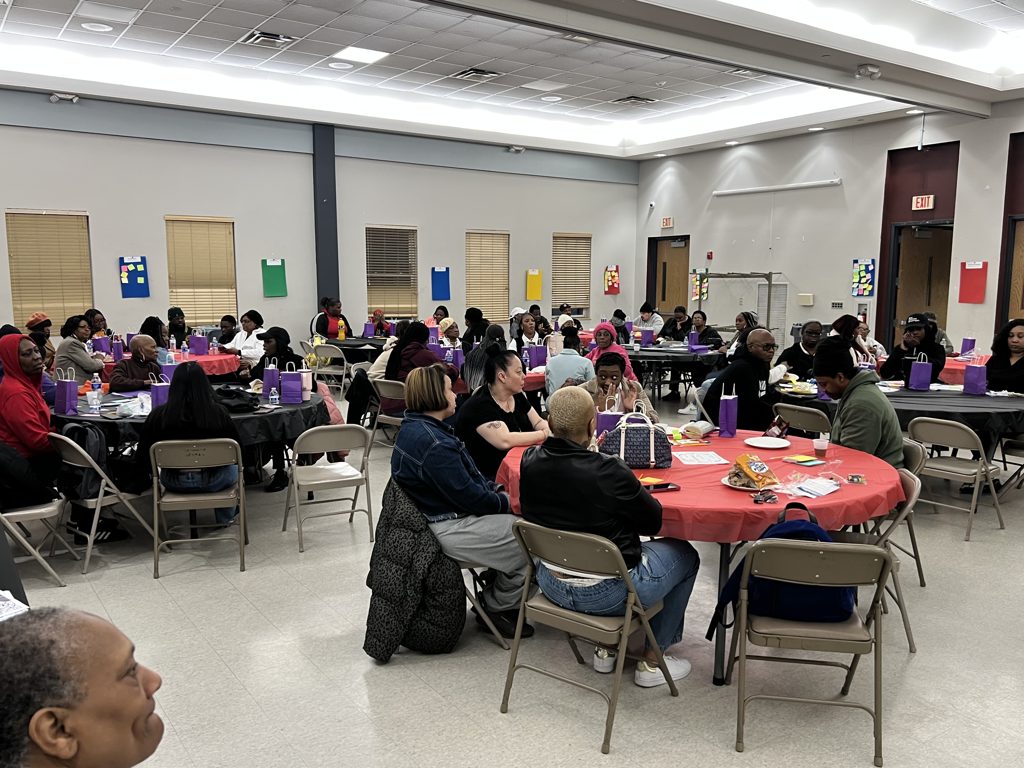Community members gathered at tables during the workshop
